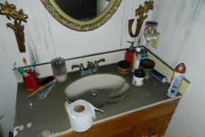 Home interior bathroom with fire damage.