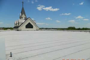 Church rooftop with hail damage.