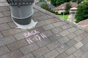 Residential roof with hail damage.