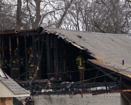 Home exterior fire damage to siding and roof.