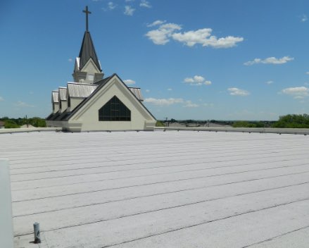 Church rooftop with hail damage.