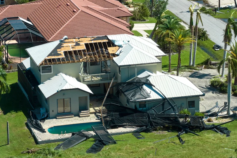 House with roof damage from wind or a tornado