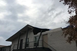 Brick apartment building with significant damage